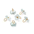 Detailed view of pearlescent light blue flower charms with gold loops for DIY jewelry. - Blue (4664)