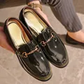 Stylish dark green patent leather loafers for men featuring gold horsebit accent. - 40 / Gradient Grey