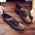 Men's brown and black casual leather loafers with elastic toggle laces on wooden table - 39 / Brown