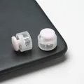 Close-up detail of pink plastic cord locks showing the internal metal spring mechanism. - Double Hole Spring Adjustment Buckle / 10 Pieces Pack / Semi-transparent Pink