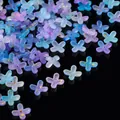 Macro detail of gradient purple and blue acrylic flower beads with gold leaf speckles. - Gold Foil Four-Petal Flower Cap / 100 Pieces/Pack / Blue Purple