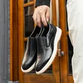 Business casual black leather loafers for men with stylish white soles held by hand - 38 / Slip-on (1530) / Black