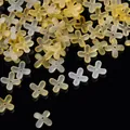 Macro view of gradient acrylic four-petal flower beads with gold flecks for DIY jewelry - Gold Foil Four-Petal Flower Cap / 100 Pieces/Pack / Orange Yellow