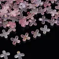 Detailed macro shot of frosted acrylic four-petal flower beads with gold foil and pink gradient - Gold Foil Four-Petal Flower Cap / 100 Pieces/Pack / Pale Blue