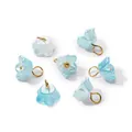 Detailed view of pearlescent light blue ABS flower pendants with golden metal jump rings - Pearlescent Blue