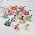 Dettaglio ravvicinato di mini fiori di seta artificiale colorati per accessori fai da te - 5 Pezzi/Confezione / Mix Casuale