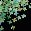 Detailed view of frosted acrylic flower beads with gold foil flecks in gradient colors - Gold Foil Four-Petal Flower Cap / 100 Pieces/Pack / Yellow Green Blue