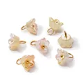 Detailed view of pearlescent ABS flower charms with gold rings for DIY jewelry making - Iridescent Pink-Yellow