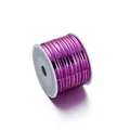 Detailed view of shiny metallic purple PET twist ties on a white plastic spool holder - 1 Roll (Approx 91 Meters) / Rose Red