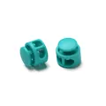 Close-up of turquoise dual-hole plastic spring cord locks for drawstring adjustment - Double Hole Spring Adjustment Buckle / 10 Pieces Pack / Solid Lake Blue