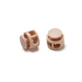 Detailed close-up of double-hole peach plastic cord locks with internal metal springs. - Double Hole Spring Adjustment Buckle / 10 Pieces Pack / Solid Khaki