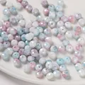 Cuentas de vidrio facetadas de 8mm teñidas al agua en colores pastel rosa y azul - Rondelle Facetada (6x8mm) / Pack de 30 / Azul y Rosa