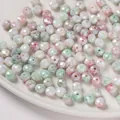 Cuentas de vidrio facetadas de 8mm con efecto marmoleado macaron para creación de joyas - Rondelle Facetada (6x8mm) / Pack de 30 / Verde y Rosa
