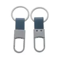 Detailed macro view showing both sides of a metal car keychain with blue leather strap. - Approx. 3*8cm / Matte Gunmetal + Light Blue