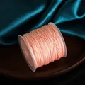 Spool of 0.8mm pink polyester chameleon jade thread cord for DIY jewelry making - Lotus Pink
