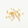 Detailed view of multiple 14K gold-plated crimp beads for DIY jewelry accessories - 1.5mm Positioning Tube (Pack of 100) (GA0067) / 18K Color-preserving Genuine Gold