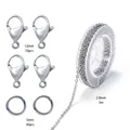 Detailed view of stainless steel jewelry kit including chain, lobster clasps, and rings. - Steel Cross Chain Material