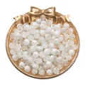 White and crackle round glass loose beads for DIY jewelry making placed in a gold plate - White