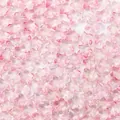 Detailansicht rosafarbener sternförmiger Glasperlen für DIY Schmuckherstellung und Basteln - Rosa