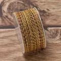 Close-up of 2.5mm colorful braided gold cord on a transparent spool - Yellow Blue Brown Purple