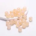 Dettaglio ravvicinato di perle a zucca in acrilico perlato per gioielli creativi fai da te. - Perlina Zucca Cangiante / 20 Pezzi/Confezione / Arancione