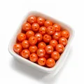 Gros plan de perles rondes en acrylique orange de 10 mm pour création de bijoux - 30 Pcs/Paquet / Orange