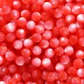 Macro view of pink cat-eye resin beads with fine glitter effect for DIY jewelry making - 20 Pieces Pack (8mm/Aperture 1.6mm) / Red