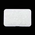 Irregular iridescent glass crushed stones in a storage box for nail art DIY. - White