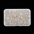 Close-up of metallic silver crushed glass stones for DIY jewelry and nail art - Silver