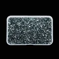 Macro view of irregular glossy teal glass crushed stones in a plastic storage box. - Metallic Blue
