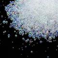 Close-up of iridescent bubble glass beads for DIY nail art and craft projects - 10g/Pack / 2-2.5mm Iridescent Transparent
