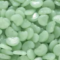 Detail view of light green Ruyi-shaped glass beads for DIY jewelry making and crafts - 10 Pieces (12x15mm)
