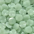 Macro detail of pale green translucent jade-style glass beads for jewelry DIY craft - 10 Pieces (15x16.5mm)