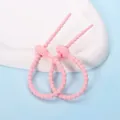 Zwei rosa verstellbare Silikon-Kabelbinder für Puppenanhänger und Kabelmanagement. - Oval-Form / 2 Stück/Set / Rosa