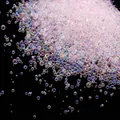 Close-up of small iridescent no-hole glass bubble beads for DIY nail art design - 10g/Pack / Light Purple