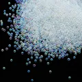 Macro detail of iridescent holeless glass bubble beads for DIY nail art and crafts - 10g/Pack / 1.5-2mm Iridescent Transparent