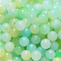 Close-up macro view of 8mm two-tone green and mint glass beads for DIY jewelry - 50 Pieces/Pack (10mm) / Yellow and Green
