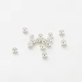 Macro shot of high-quality silver spacer beads for DIY jewelry making - 1.5mm (100 Pieces/Pack) / Silver Tone Gold Plated