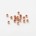 Detailed view of polished rose gold-plated copper spacer beads for DIY jewelry - 1.5mm (100 Pieces/Pack) / Rose Gold Plated