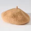 Close-up detail of the soft plush texture on a thick warm camel beret hat for women - One Size / Warm Camel