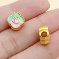 Detailed macro view of golden alloy clover bead with enamel Fu character for jewelry DIY crafts - Koi Blessing Character Spacer Bead (28534) / 1 Piece (10x11x6mm) / Green Matte Gold