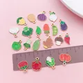 Close-up of various vegetable enamel charms with a brown ruler for size comparison. - 20 Vegetable Enamel Styles (SN1771) / 20 Pieces Set