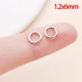 1,2x6mm roestvrijstalen open buigringen voor DIY sieraden maken getoond op een vingertop - 1.2x6mm (1 Stuk)