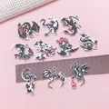 Detailed view of dark gothic dragon enamel charms with ruler for size reference - Drip Oil Dragon 10-Piece Set / 10 Pieces Pack