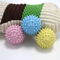 Set of three durable TPR spiked rubber toy balls for dog teeth cleaning and chewing - Paw Print Spike Ball