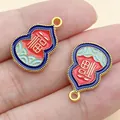 Detail of Chinese gourd charms with red and blue enamel and gold Fu character detail. - Double Sided Fu Gourd (22808)