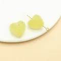 Close-up of yellow frosted heart-shaped sugar beads for DIY jewelry and hair accessories - Heart Style (23738) / 1 Piece (17x20x12mm) / Transparent Yellow