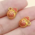 Macro detail view of gold-tone gourd charms featuring red 'Fu' character engraving - Double Sided Fu Money Bag (28493)