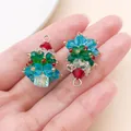 Close-up of handmade mini crystal beaded Christmas tree pendants on hand - Blue Crystal Beaded Christmas Tree (28620)