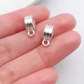 Close-up of silver-colored ribbed jewelry bail connectors for DIY bracelet beads - Retro Pattern (20674) / 1 Piece (12x5mm) / Bright Silver